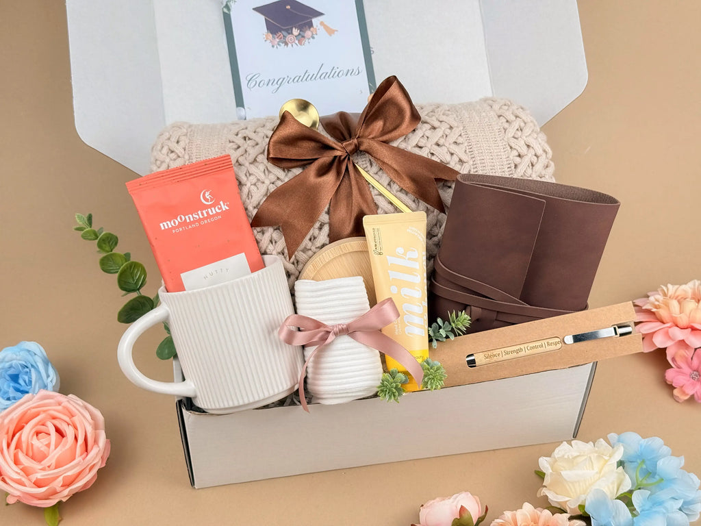 Graduation Gift Box for Him or Her – Luxury Congratulations Gift Basket with Knitted Throw Blanket, Leather Journal, Ceramic Mug, and Gourmet Cocoa Set
