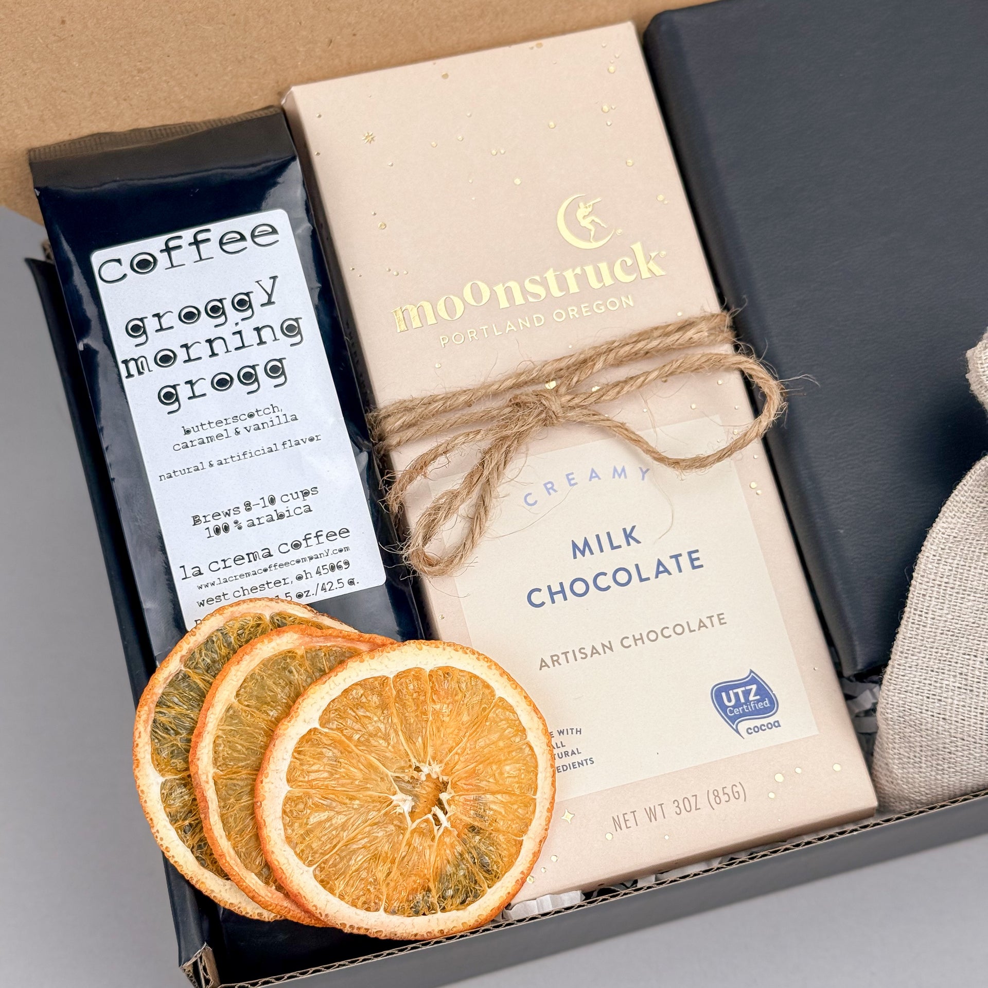 Cozy Coffee Gift Box with Ground Coffee, Notebook with Gold Pen, Milk Chocolate Espresso Bar, Caramel Candles, Dried Orange Slices Zoom