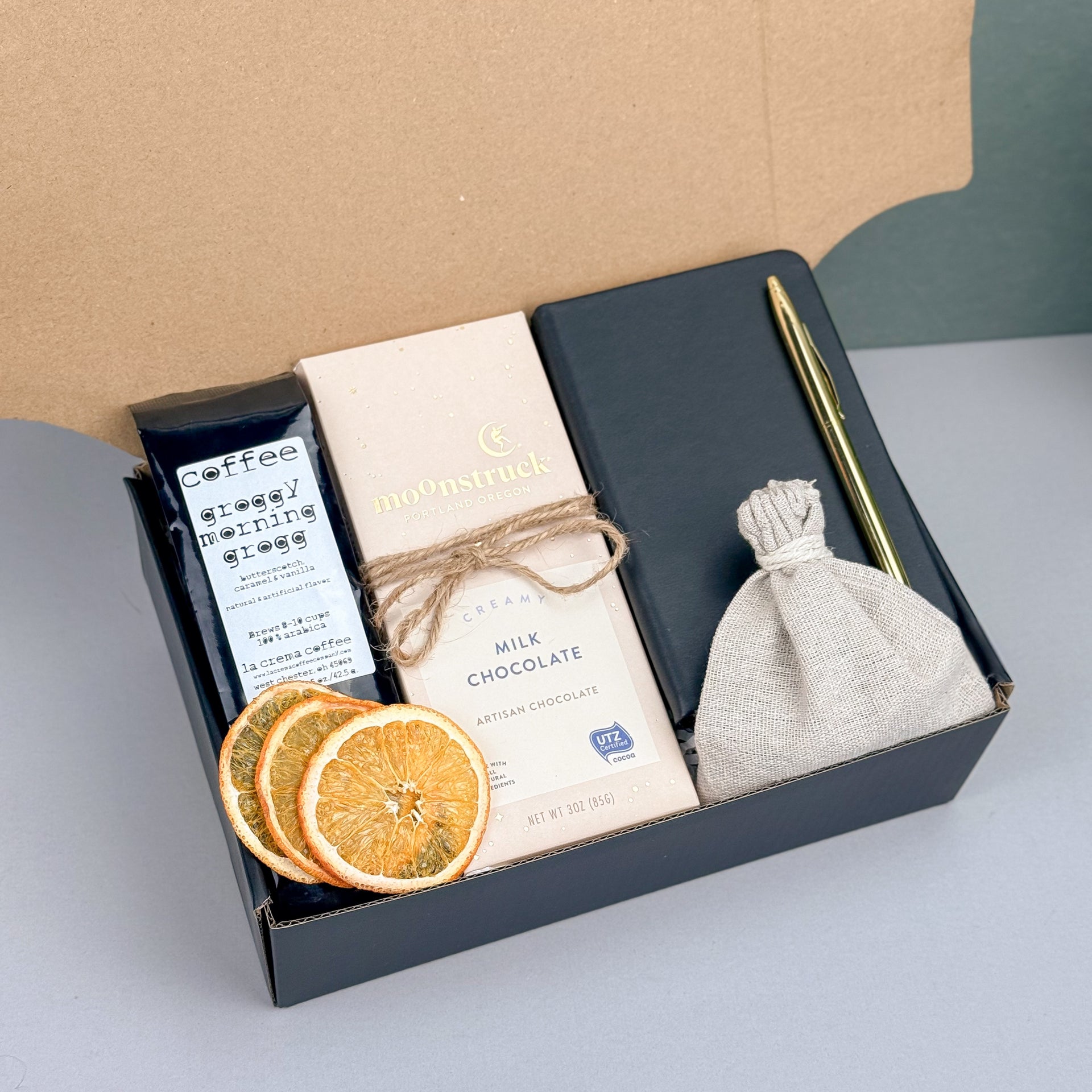 Cozy Coffee Gift Box with Ground Coffee, Notebook with Gold Pen, Milk Chocolate Espresso Bar, Caramel Candles, Dried Orange Slices