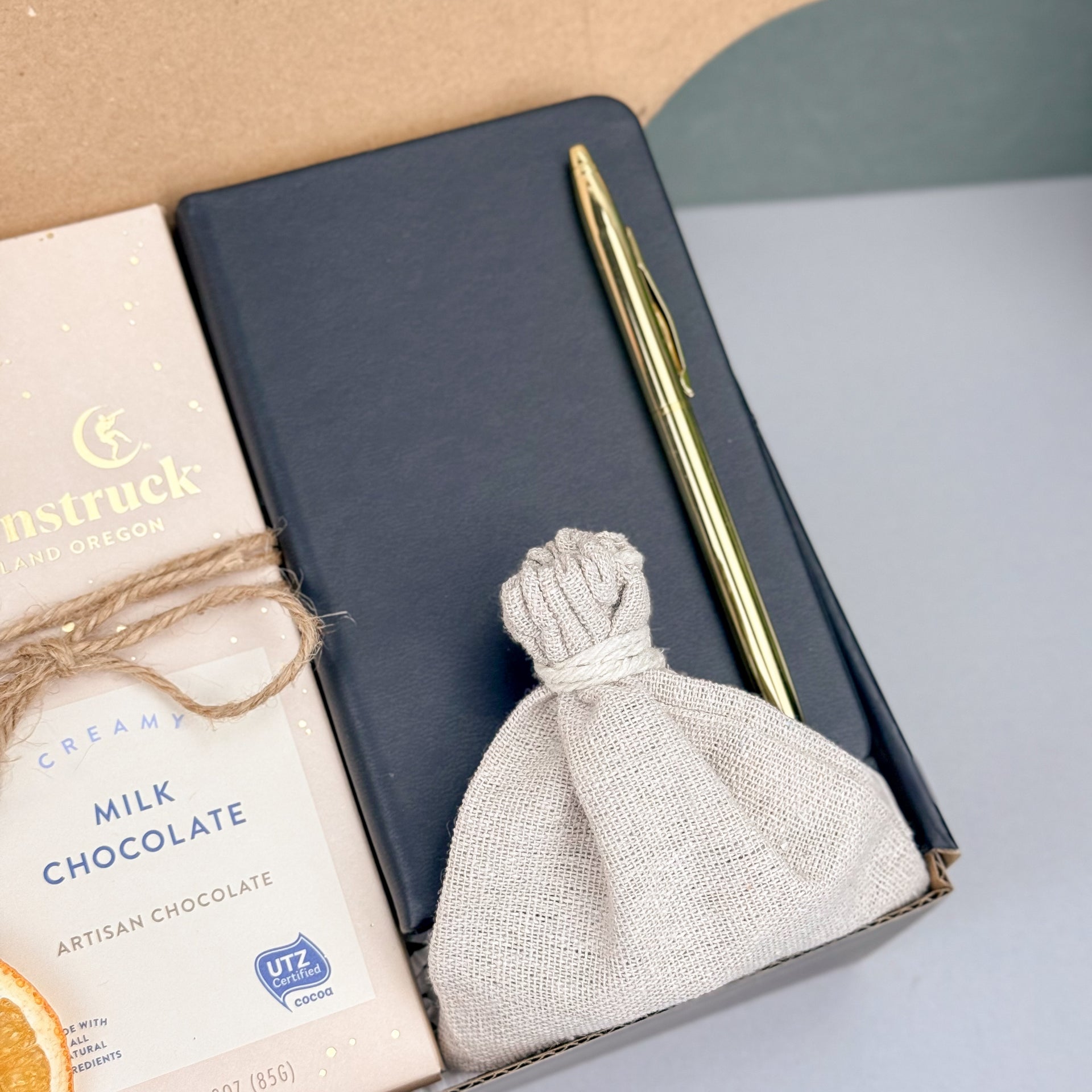 Cozy Coffee Gift Box with Ground Coffee, Notebook with Gold Pen, Milk Chocolate Espresso Bar, Caramel Candles, Dried Orange Slices Right